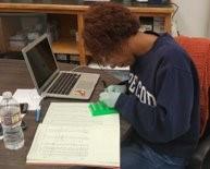 female student analyzing data